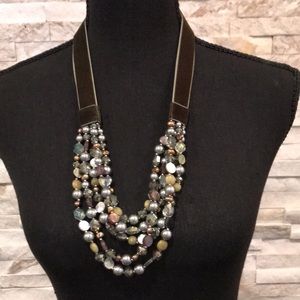 Chico’s faux jewels necklace.  5 strands set on a velvet band w/back closure.